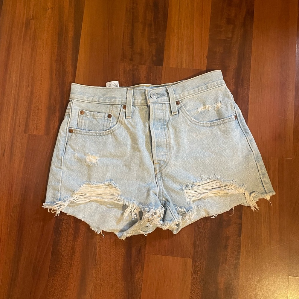 Levi’s 501 Distressed Light Blue Denim Shorts